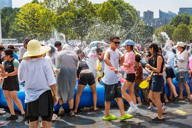 GUIYANG, CHINA - AUGUST 09: Citizens and tourists splash water on each other during the Summer Wonderland Ethnic Group Celebration at Guanshanhu Park on August 9, 2026 in Guiyang, Guizhou Province of China. The event features water splashing activities allowing participants to cool off during the summer heat.  Copyright: xVCGx 111659117632