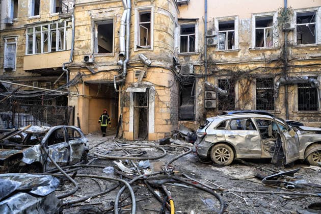 A State Emergency Service worker emerges from a passage in the courtyard of a multi-storey apartment block damaged by a Russian attack, Odesa, Ukraine, August 9, 2026. On Sunday night, August 9, the Russian army carried out a massive combined attack on Odesa, causing significant destruction in two districts of the southern Ukrainian port city. In central Odesa, a Russian missile hit a four-storey residential building, where two floors were completely burnt out. Two private houses and offices were also damaged. At least six civilian cars were destroyed or badly damaged in courtyards by falling debris and direct hits. Damage to energy facilities led to a temporary blackout, with partial power outages in the Peresypskyi (Poskot), Prymorskyi, K  Copyright: xNinaxLiashonokx