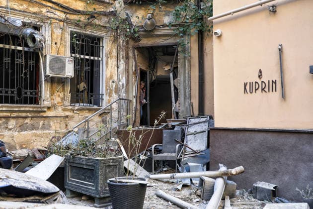 A woman stands in the doorway of a multi-storey apartment block damaged by a Russian attack, Odesa, Ukraine, August 9, 2026. On Sunday night, August 9, the Russian army carried out a massive combined attack on Odesa, causing significant destruction in two districts of the southern Ukrainian port city. In central Odesa, a Russian missile hit a four-storey residential building, where two floors were completely burnt out. Two private houses and offices were also damaged. At least six civilian cars were destroyed or badly damaged in courtyards by falling debris and direct hits. Damage to energy facilities led to a temporary blackout, with partial power outages in the Peresypskyi (Poskot), Prymorskyi, Khadzhybeiskyi and Odesa districts. The city  Copyright: xNinaxLiashonokx