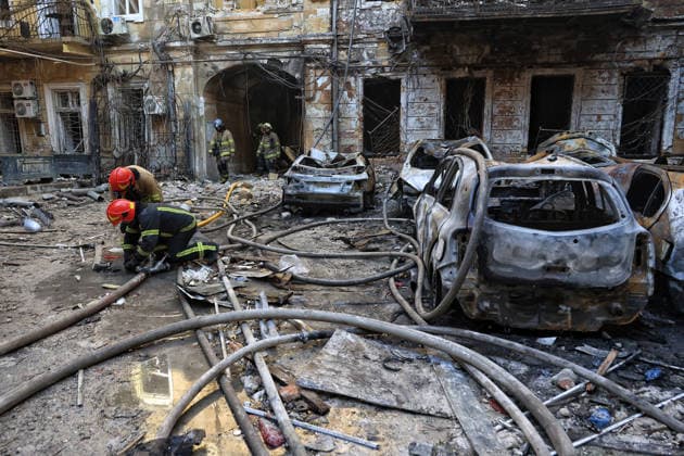 State Emergency Service workers deal with the aftermath of a Russian strike in the courtyard of a multi-storey apartment block, Odesa, Ukraine, August 9, 2026. On Sunday night, August 9, the Russian army carried out a massive combined attack on Odesa, causing significant destruction in two districts of the southern Ukrainian port city. In central Odesa, a Russian missile hit a four-storey residential building, where two floors were completely burnt out. Two private houses and offices were also damaged. At least six civilian cars were destroyed or badly damaged in courtyards by falling debris and direct hits. Damage to energy facilities led to a temporary blackout, with partial power outages in the Peresypskyi (Poskot), Prymorskyi, Khadzhybe  Copyright: xNinaxLiashonokx