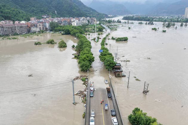 WENZHOU, CHINA - AUGUST 10: A general view shows a village and farmland flooded after Typhoon Dolphin on August 10, 2026 in Wenzhou, Zhejiang Province of China. Strong winds up to level 15 (46.2 to 50.9 meters per second) have ripped through Yueqing City in east China s Zhejiang Province since Typhoon Dolphin made landfall in the region on Sunday, with hundreds of toppled trees and broken branches blocking roads across the city.  Copyright: xVCGx 111659124831