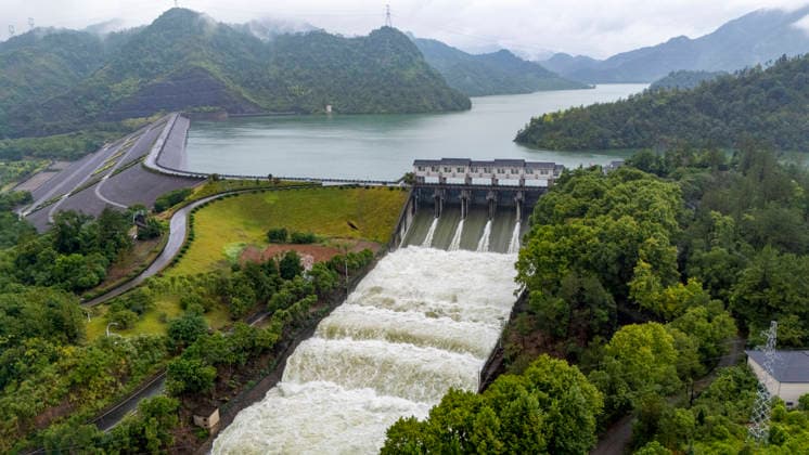 JINHUA, CHINA - AUGUST 10: The Jinlan Reservoir opens its sluice gates to release water for flood control on August 10, 2026 in Jinhua, Zhejiang Province of China. Typhoon Dolphin, the 13th typhoon of the year, made landfall at Yuhuan of Taizhou City, east China s Zhejiang Province, at around 5:30 p.m. on August 9.  Copyright: xVCGx 111659130389