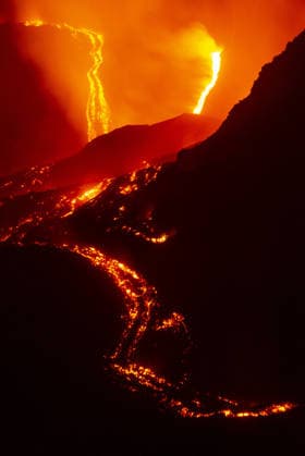Mount Etna s eruptive phase persists CATANIA, ITALY - AUGUST 10: Mount Etna s eruptive phase persists with fluctuating explosive dynamics at the Voragine summit crater in Catania, Sicily, Italy on August 10, 2026. The ongoing unrest is marked by the ejection of volcanic bombs in the upper peak area and heavy ash plumes. Additionally, the fissures situated at elevations of 2,750 and 2,360 meters continue to actively discharge magma, creating intricate and overlapping lava streams currently restricted between 2,100 and 1,850 meters. A thick cloud of volcanic debris is drifting south-southeast, causing officials to uphold a red aviation warning. The persistent airborne ash compelled airport authorities to temporarily halt all inbound flights a  Copyright: x2026xAnadoluxSalvatorexAllegrax