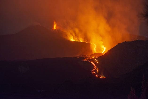 Mount Etna s eruptive phase persists CATANIA, ITALY - AUGUST 10: Mount Etna s eruptive phase persists with fluctuating explosive dynamics at the Voragine summit crater in Catania, Sicily, Italy on August 10, 2026. The ongoing unrest is marked by the ejection of volcanic bombs in the upper peak area and heavy ash plumes. Additionally, the fissures situated at elevations of 2,750 and 2,360 meters continue to actively discharge magma, creating intricate and overlapping lava streams currently restricted between 2,100 and 1,850 meters. A thick cloud of volcanic debris is drifting south-southeast, causing officials to uphold a red aviation warning. The persistent airborne ash compelled airport authorities to temporarily halt all inbound flights a  Copyright: x2026xAnadoluxSalvatorexAllegrax