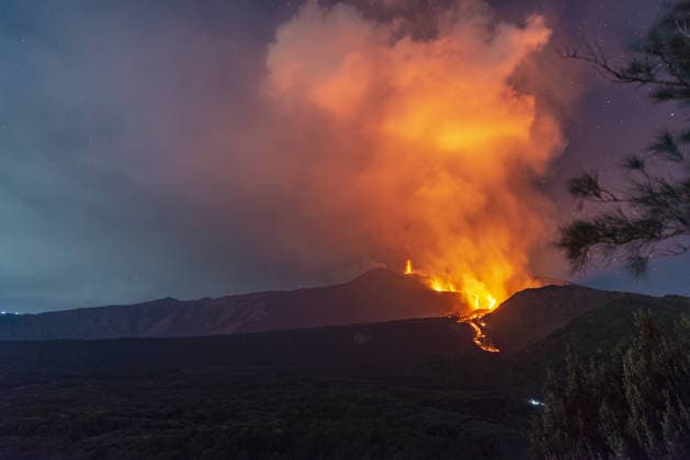 Mount Etna s eruptive phase persists CATANIA, ITALY - AUGUST 10: Mount Etna s eruptive phase persists with fluctuating explosive dynamics at the Voragine summit crater in Catania, Sicily, Italy on August 10, 2026. The ongoing unrest is marked by the ejection of volcanic bombs in the upper peak area and heavy ash plumes. Additionally, the fissures situated at elevations of 2,750 and 2,360 meters continue to actively discharge magma, creating intricate and overlapping lava streams currently restricted between 2,100 and 1,850 meters. A thick cloud of volcanic debris is drifting south-southeast, causing officials to uphold a red aviation warning. The persistent airborne ash compelled airport authorities to temporarily halt all inbound flights a  Copyright: x2026xAnadoluxSalvatorexAllegrax