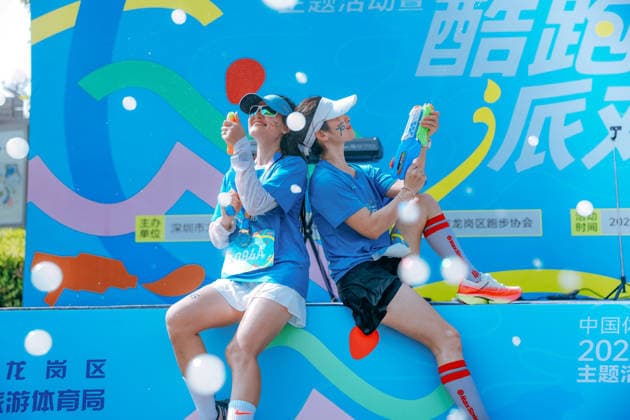SHENZHEN, CHINA - AUGUST 08: Participants take part in the Run, Teenagers 2026 Longgang District National Fitness Day themed event at Shenzhen Universiade Sports Centre on August 8, 2026 in Longgang District, Shenzhen City, Guangdong Province of China. The event marks the 18th National Fitness Day, featuring a morning run followed by water gun battles and a music party to promote public fitness.  Copyright: xVCGx 111659152037