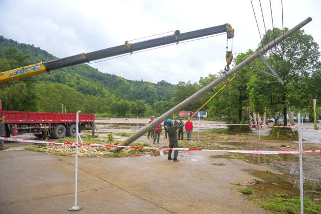 (260810) -- WENZHOU, Aug. 10, 2026 -- Electrical workers carry out emergency repairs on a fallen utility pole toppled by Typhoon Dolphin in Lianfeng Village in Wenzhou, east China s Zhejiang Province, Aug. 10, 2026. Typhoon Dolphin is moving inland after making two landfalls along the coast of east China s Zhejiang Province and is expected to bring heavy precipitation to more than 10 provincial-level regions, according to China s National Meteorological Center on Monday. ) CHINA-ZHEJIANG-WENZHOU-TYPHOON DOLPHIN-IMPACT (CN) JiangxHan 