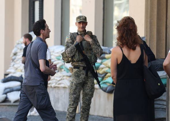 Zagreb, Croatia,100826 Filming of a movie about the war in Ukraine, directed by Doug Liman, outside the famous Hotel Esplanade in Zagreb, featuring Hollywood stars Sean Penn and Adrien Brody. Pictured: Adrien Brody. Photo: Ranko Suvar CROPIX Zagreb Croatia Copyright: xxRankoxSuvarx esplanade_film28-100826