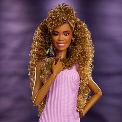 Whitney Houston celebrated with her own Barbie doll Whitney Houston is being celebrated with her own Barbie doll., , The first-ever Barbie of the late singer was released on Sunday (AUGUST 9), on what would have been her 63rd birthday., , The Barbie Signature Whitney Houston Doll recreates Whitney’s look in the 1987 music video for her huge hit I Wanna Dance with Somebody (Who Loves Me) ., , The doll is styled in a replica of the purple tank dress with drop earrings and Whitney’s vibrant eye makeup, and comes complete with a microphone stand., , Mattel says the doll celebrates Whitney’s record-breaking career, legacy and timeless music that inspired generations of artists and continues to resonate with fans around the world. , , It is now  Copyright: xThexMegaxAgencyxMattelxInc. Megax