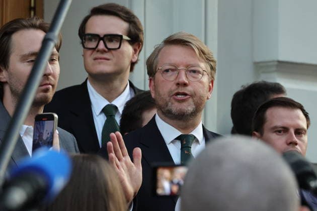 RUSSIA, MOSCOW - AUGUST 10, 2026: Nikolai Rybakov (C), Chairman of the Yabloko Russian United Democratic Party, appears before the media after a Russian Supreme Court hearing into a bid by Rodina to disqualify Yabloko from the 2026 State Duma election. Yevgeny Messman TASS  96000088
