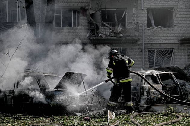 A rescuer extinguishes a fire in a car destroyed by a Russian air strike, Zaporizhzhia, Ukraine, August 10, 2026. Russian forces attacked civilian infrastructure in the regional capital and the Zaporizhzhia district with guided aerial bombs. Apartment blocks and private houses were damaged, and cars were wrecked. At least 24 people were injured, including two children. (Photo by Dmytro Smolienko Ukrinform) Russian army attacks Zaporizhzhia with guided bombs again  Copyright: xDmytroxSmolienkox