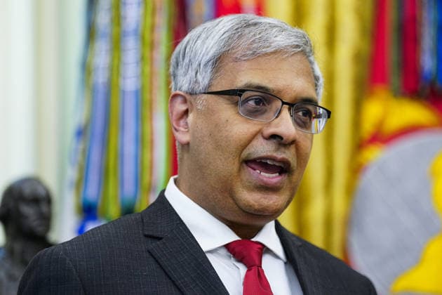 Director of the National Institutes of Health (NIH) Jayanta Bhattacharya speaks before President Donald Trump (not pictured) signs an executive order that reevaluates childhood vaccines in the Oval Office of the White House in Washington, DC on August 10, 2026. While the executive order still recommends childhood vaccines for 11 diseases, including measles and polio, it calls for limiting vaccines for other diseases, like hepatitis A and B and meningococcal disease, to high-risk populations.  WAP20260810115 BONNIExCASH
