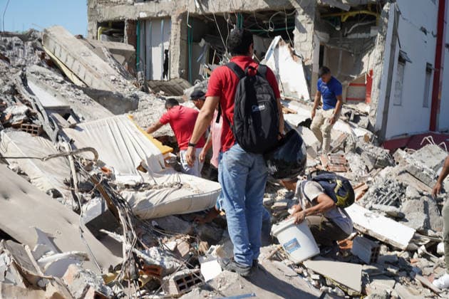 August 10, 2026, Cali, Valle Del Cauca, Colombia: People gather outside rubble of a collapsed building to search for survivors in Cali after a 7,4 Earthquake that struck Colombia on August 10, 2026. Cali Colombia  - ZUMAvp1_ 20260810_zia_vp1_012 Copyright: xSebastianxMarmolejox