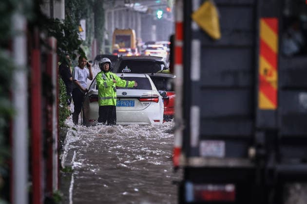 SHANGHAI, CHINA - AUGUST 10: A general view shows waterlogged roads and heavy rain due to Typhoon Dolphin on August 10, 2026 in Shanghai, China. The city experienced intense rainfall and strong winds as Typhoon Dolphin made impact, causing flooding in several areas.  Copyright: xVCGx 111659181674