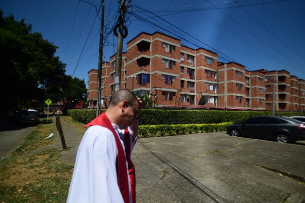 111 killed, 87 injured as magnitude 7.4 earthquake strikes Colombia CALI, COLOMBIA - AUGUST 10: A damaged residential building is visible in the background as a member of the clergy walks through an area affected by a magnitude 7.4 earthquake that struck western Colombia, on August 10, 2026 in Cali, Colombia. Preliminary reports indicate that several structures collapsed, buildings and roads were damaged, and some public services were temporarily disrupted. Hospitals activated emergency plans to treat the injured, while technical teams began assessing damaged buildings as authorities warned residents to avoid unsafe structures and remain alert for aftershocks. Edwin Rodriguez Pipicano Anadolu Cali Colombia. Editorial use only. Please get  Copyright: x2026xAnadoluxEdwinxRodriguezxPipicanox