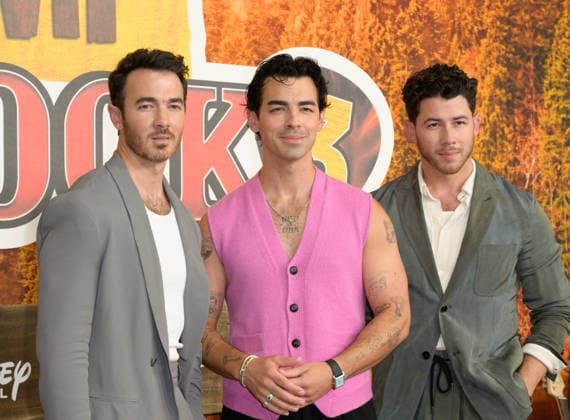 BURBANK, USA, August 10, 2026: Kevin Jonas, Joe Jonas, and Nick Jonas at the world premiere of Disney s *Camp Rock 3* at the Walt Disney Studio Lot. Photo by Paul Smith, Featureflash 458817, August 10, 2026, Burbank, CA  Copyright: xPaulxSmithx xFeaturesxFlashx xStarfacex STAR_458817_008