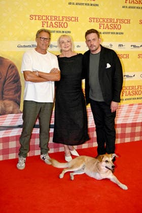 Christian Tramitz, Rita Falk, Hund Noah, Sebastian Bezzel - Weltpremiere Steckerlfischfiasko Mathaeser Filmpalast in Muenchen - 10.August 2026 *** Christian Tramitz, Rita Falk, Noah the Dog, Sebastian Bezzel; World Premiere of *Steckerlfischfiasko* at the Mathaeser Filmpalast in Munich, August 10, 2026