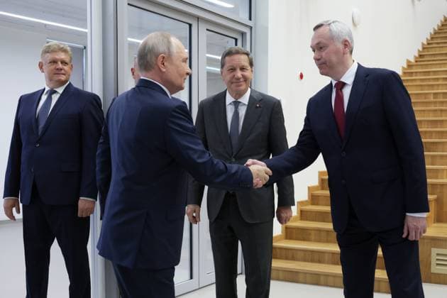 Russia Putin Siberian Federal District 9220463 11.08.2026 Russian President Vladimir Putin shakes hands with Novosibirsk Region Governor Andrei Travnikov, as Presidential Envoy to the Siberian Federal District Anatoly Seryshev and State Duma First Deputy Speaker Alexander Zhukov stand nearby, during his visit to a recreation facility at the Specialized Educational and Scientific Centre of Novosibirsk State University (NSU) in Novosibirsk, Russia. Gavriil Grigorov Sputnik Novosibirsk Region Russia  Copyright: xGavriilxGrigorovx
