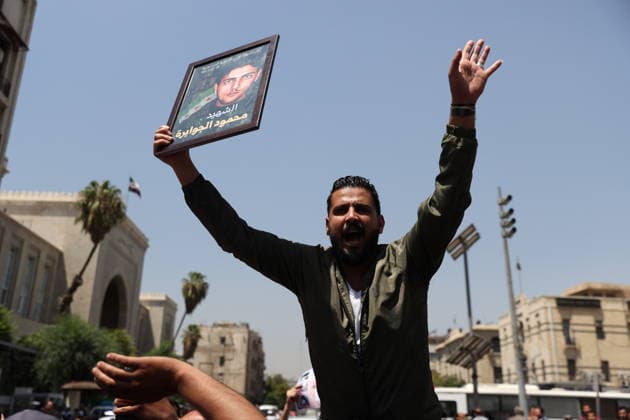Death sentences for Bashar al-Assad and senior figures in Syria welcomed with celebrations DAMASCUS, SYRIA - AUGUST 11: Syrians gather around the Palace of Justice to celebrate a court s death sentences against ousted leader Bashar al-Assad, his brother Maher al-Assad and his cousin Atef Najib, carrying photographs of people killed by the Assad regime, in the capital Damascus, Syria, on August 11, 2026. Izz Aldien Alqasem Anadolu Damascus Syria. Editorial use only. Please get in touch for any other usage.  Copyright: x2026xAnadoluxIzzxAldienxAlqasemx