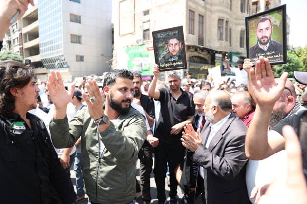 Death sentences for Bashar al-Assad and senior figures in Syria welcomed with celebrations DAMASCUS, SYRIA - AUGUST 11: Syrians gather around the Palace of Justice to celebrate a court s death sentences against ousted leader Bashar al-Assad, his brother Maher al-Assad and his cousin Atef Najib, carrying photographs of people killed by the Assad regime, in the capital Damascus, Syria, on August 11, 2026. Izz Aldien Alqasem Anadolu Damascus Syria. Editorial use only. Please get in touch for any other usage.  Copyright: x2026xAnadoluxIzzxAldienxAlqasemx
