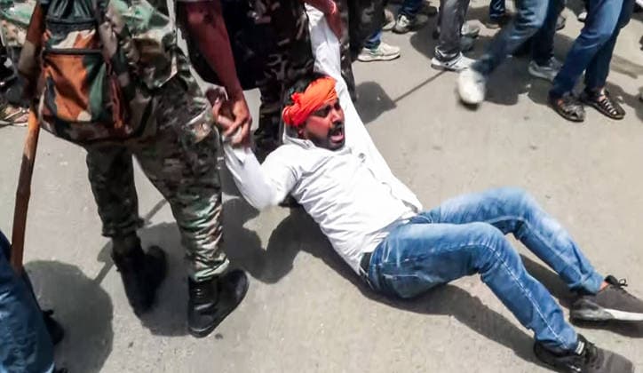 RECORD DATE NOT STATED Protest Over Irregularities in the Recruitment Examinations in Ranchi Ranchi, Aug 11 (ANI): Security personnel detain a protester during the protest by ABVP workers and the statewide Jharkhand Bandh over the alleged irregularities in recruitment examinations, in Ranchi on Tuesday. (ANI Video Grab) Ranchi Jharkhand India Copyright: xANIx ANI_20260811090