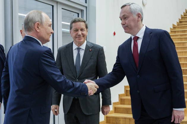 RUSSIA, NOVOSIBIRSK - AUGUST 11, 2026: Russia s President Vladimir Putin, Russian State Duma s First Deputy Speaker Alexander Zhukov, and Novosibirsk Region Governor Andrei Travnikov (L-R) visit the Specialised Educational Scientific Centre of Novosibirsk State University Novosibirsk Russia  - ZUMAt113 20260811_zaa_t113_185 Copyright: xGavriilxGrigorovx