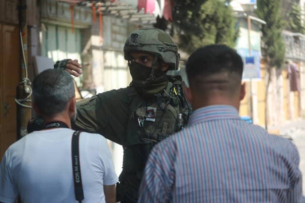 Israeli Forces Restrict Palestinian Movement in Hebron Old City Israeli soldiers deploy in the streets of the Old City of Hebron, in the occupied West Bank, on August 11, 2026, as Israeli forces close several entrances and roads and restrict the movement of Palestinians. The measures coincide with Israeli settlers entering the Old City. Photo by Mamoun Wazwaz apaimages Hebron West Bank Palestinian Territory 110826_Hebron_MW_00(41) Copyright: xapaimagesxMamounxWazwazx xapaimagesx