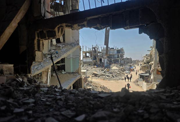 Palestinians Clear Rubble to Return to Destroyed Homes in Khan Younis Palestinians clear rubble from their destroyed homes in Khan Younis refugee camp in the southern Gaza Strip, on August 11, 2026, as they prepare to move their tents to the area amid continued rubble accumulation and delays in debris removal and reconstruction. Families say overcrowding and the spread of insects and rodents in displacement areas have prompted them to try to return to the sites of their destroyed homes. Photo by Tariq Mohammad APA Images Khan Yunis Gaza Strip Palestinian Territory 110826_Khan_Yunis_TM_01(16) Copyright: xapaimagesxTariqxMohammad xapaimagesx