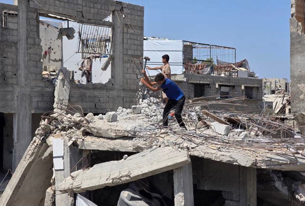 Palestinians Clear Rubble to Return to Destroyed Homes in Khan Younis Palestinians clear rubble from their destroyed homes in Khan Younis refugee camp in the southern Gaza Strip, on August 11, 2026, as they prepare to move their tents to the area amid continued rubble accumulation and delays in debris removal and reconstruction. Families say overcrowding and the spread of insects and rodents in displacement areas have prompted them to try to return to the sites of their destroyed homes. Photo by Tariq Mohammad APA Images Khan Yunis Gaza Strip Palestinian Territory 110826_Khan_Yunis_TM_01(21) Copyright: xapaimagesxTariqxMohammad xapaimagesx