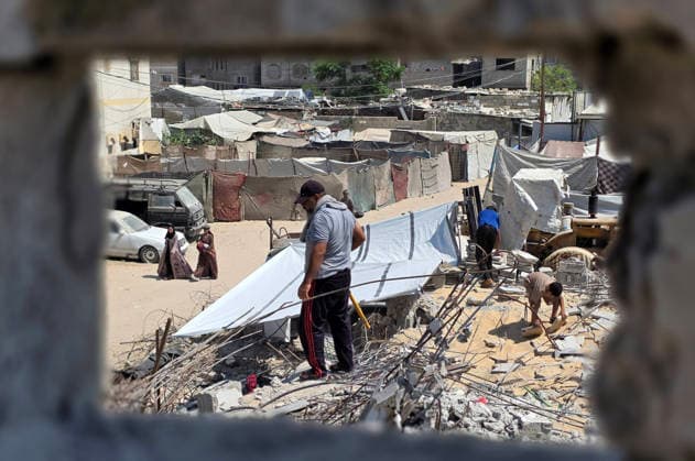 Palestinians Clear Rubble to Return to Destroyed Homes in Khan Younis Palestinians clear rubble from their destroyed homes in Khan Younis refugee camp in the southern Gaza Strip, on August 11, 2026, as they prepare to move their tents to the area amid continued rubble accumulation and delays in debris removal and reconstruction. Families say overcrowding and the spread of insects and rodents in displacement areas have prompted them to try to return to the sites of their destroyed homes. Photo by Tariq Mohammad APA Images Khan Yunis Gaza Strip Palestinian Territory 110826_Khan_Yunis_TM_01(4) Copyright: xapaimagesxTariqxMohammad xapaimagesx