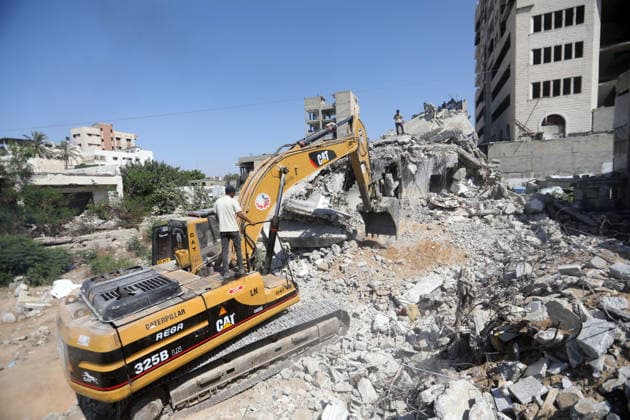 Civil Defense Teams Recover Bodies From Gaza City Rubble Palestinian Civil Defense members, in cooperation with the International Committee of the Red Cross (ICRC), work with limited resources to recover bodies from beneath the rubble of a home belonging to the Gharbiya family in western Gaza City, Gaza Strip, on August 11, 2026. Medics say 13 bodies remain trapped under the rubble, as search and recovery operations continue amid a severe shortage of heavy equipment needed to clear debris and reach the victims. Photo by Bilal Osama apaimages Gaza city Gaza Strip Palestinian Territory 110826_Gaza_BO_01(1) Copyright: xapaimagesxBilalxOsamax xapaimagesx