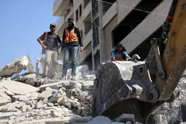 Civil Defense Teams Recover Bodies From Gaza City Rubble Palestinian Civil Defense members, in cooperation with the International Committee of the Red Cross (ICRC), work with limited resources to recover bodies from beneath the rubble of a home belonging to the Gharbiya family in western Gaza City, Gaza Strip, on August 11, 2026. Medics say 13 bodies remain trapped under the rubble, as search and recovery operations continue amid a severe shortage of heavy equipment needed to clear debris and reach the victims. Photo by Bilal Osama apaimages Gaza city Gaza Strip Palestinian Territory 110826_Gaza_BO_01(16) Copyright: xapaimagesxBilalxOsamax xapaimagesx