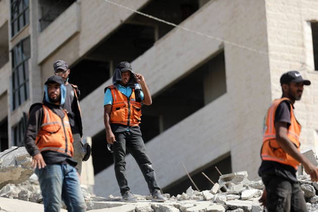 Civil Defense Teams Recover Bodies From Gaza City Rubble Palestinian Civil Defense members, in cooperation with the International Committee of the Red Cross (ICRC), work with limited resources to recover bodies from beneath the rubble of a home belonging to the Gharbiya family in western Gaza City, Gaza Strip, on August 11, 2026. Medics say 13 bodies remain trapped under the rubble, as search and recovery operations continue amid a severe shortage of heavy equipment needed to clear debris and reach the victims. Photo by Bilal Osama apaimages Gaza city Gaza Strip Palestinian Territory 110826_Gaza_BO_01(21) Copyright: xapaimagesxBilalxOsamax xapaimagesx