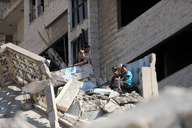 Civil Defense Teams Recover Bodies From Gaza City Rubble Palestinian Civil Defense members, in cooperation with the International Committee of the Red Cross (ICRC), work with limited resources to recover bodies from beneath the rubble of a home belonging to the Gharbiya family in western Gaza City, Gaza Strip, on August 11, 2026. Medics say 13 bodies remain trapped under the rubble, as search and recovery operations continue amid a severe shortage of heavy equipment needed to clear debris and reach the victims. Photo by Bilal Osama apaimages Gaza city Gaza Strip Palestinian Territory 110826_Gaza_BO_01(33) Copyright: xapaimagesxBilalxOsamax xapaimagesx