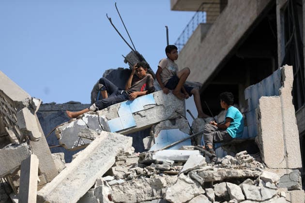 Civil Defense Teams Recover Bodies From Gaza City Rubble Palestinian Civil Defense members, in cooperation with the International Committee of the Red Cross (ICRC), work with limited resources to recover bodies from beneath the rubble of a home belonging to the Gharbiya family in western Gaza City, Gaza Strip, on August 11, 2026. Medics say 13 bodies remain trapped under the rubble, as search and recovery operations continue amid a severe shortage of heavy equipment needed to clear debris and reach the victims. Photo by Bilal Osama apaimages Gaza city Gaza Strip Palestinian Territory 110826_Gaza_BO_01(39) Copyright: xapaimagesxBilalxOsamax xapaimagesx