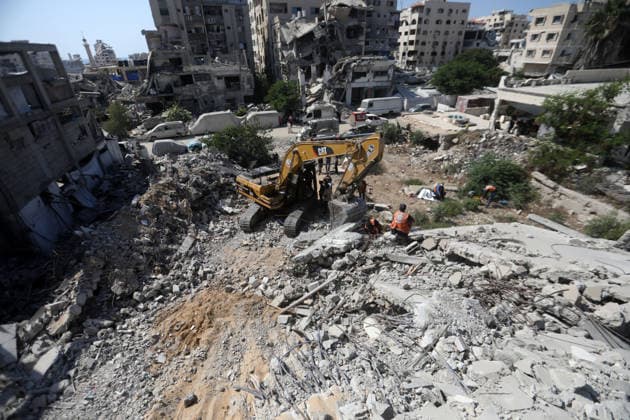 Civil Defense Teams Recover Bodies From Gaza City Rubble Palestinian Civil Defense members, in cooperation with the International Committee of the Red Cross (ICRC), work with limited resources to recover bodies from beneath the rubble of a home belonging to the Gharbiya family in western Gaza City, Gaza Strip, on August 11, 2026. Medics say 13 bodies remain trapped under the rubble, as search and recovery operations continue amid a severe shortage of heavy equipment needed to clear debris and reach the victims. Photo by Bilal Osama apaimages Gaza city Gaza Strip Palestinian Territory 110826_Gaza_BO_01(41) Copyright: xapaimagesxBilalxOsamax xapaimagesx