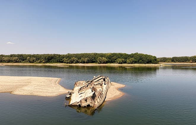 World War II-German warships emerge from Danube amid low water levels in Serbia PRAHOVO, SERBIA - AUGUST 11: Sunken hulls of World War II-era Nazi warships lie exposed in the Danube River near Prahovo, Serbia on August 11, 2026. Extreme heat and severe drought across Europe have caused water levels in the river to drop to historic lows, revealing dozens of scuttled German vessels laden with explosives from 1944. According to some estimates, around 200 World War II shipwrecks lie on the sandy bed of the Danube. Sasa Djordjevic Anadolu Prahovo Serbia. Editorial use only. Please get in touch for any other usage.  Copyright: x2026xAnadoluxSasaxDjordjevicx