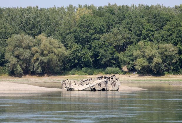 World War II-German warships emerge from Danube amid low water levels in Serbia PRAHOVO, SERBIA - AUGUST 11: Sunken hulls of World War II-era Nazi warships lie exposed in the Danube River near Prahovo, Serbia on August 11, 2026. Extreme heat and severe drought across Europe have caused water levels in the river to drop to historic lows, revealing dozens of scuttled German vessels laden with explosives from 1944. According to some estimates, around 200 World War II shipwrecks lie on the sandy bed of the Danube. Sasa Djordjevic Anadolu Prahovo Serbia. Editorial use only. Please get in touch for any other usage.  Copyright: x2026xAnadoluxSasaxDjordjevicx
