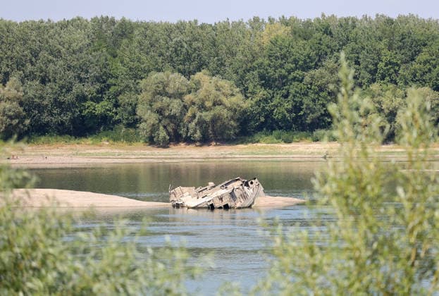 World War II-German warships emerge from Danube amid low water levels in Serbia PRAHOVO, SERBIA - AUGUST 11: Sunken hulls of World War II-era Nazi warships lie exposed in the Danube River near Prahovo, Serbia on August 11, 2026. Extreme heat and severe drought across Europe have caused water levels in the river to drop to historic lows, revealing dozens of scuttled German vessels laden with explosives from 1944. According to some estimates, around 200 World War II shipwrecks lie on the sandy bed of the Danube. Sasa Djordjevic Anadolu Prahovo Serbia. Editorial use only. Please get in touch for any other usage.  Copyright: x2026xAnadoluxSasaxDjordjevicx