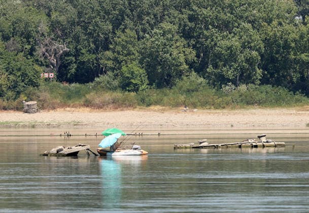 World War II-German warships emerge from Danube amid low water levels in Serbia PRAHOVO, SERBIA - AUGUST 11: Sunken hulls of World War II-era Nazi warships lie exposed in the Danube River near Prahovo, Serbia on August 11, 2026. Extreme heat and severe drought across Europe have caused water levels in the river to drop to historic lows, revealing dozens of scuttled German vessels laden with explosives from 1944. According to some estimates, around 200 World War II shipwrecks lie on the sandy bed of the Danube. Sasa Djordjevic Anadolu Prahovo Serbia. Editorial use only. Please get in touch for any other usage.  Copyright: x2026xAnadoluxSasaxDjordjevicx