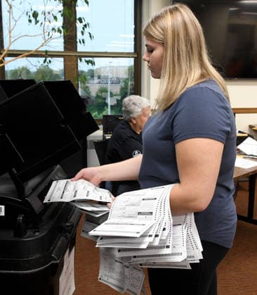 August 11, 2026, Racine, Wisconsin, USA: Some 2500 early voting and absentee ballots are processed at Central Count at Racine City Hall in the Wisconsin primary election Tuesday August 11, 2026. National focus is on the Democratic gubernatorial primary and on efforts to flip several Republican congressional seats, including that of incumbent Bryan Steil who represents the First Congressional District, including Racine County. Racine USA - ZUMAh154 20260811_znp_h154_029 Copyright: xMarkxHertzbergx