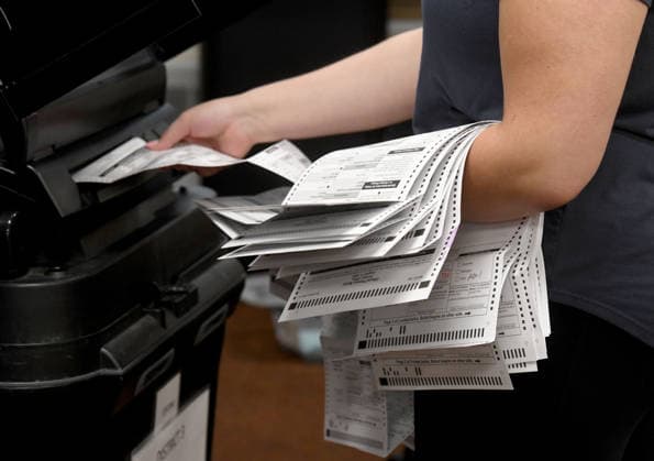 August 11, 2026, Racine, Wisconsin, USA: Some 2500 early voting and absentee ballots are processed at Central Count at Racine City Hall in the Wisconsin primary election Tuesday August 11, 2026. National focus is on the Democratic gubernatorial primary and on efforts to flip several Republican congressional seats, including that of incumbent Bryan Steil who represents the First Congressional District, including Racine County. Racine USA - ZUMAh154 20260811_znp_h154_028 Copyright: xMarkxHertzbergx