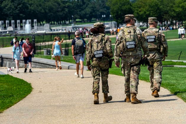 Members of the National Guard patrol near the Washington Monument in Washington, DC on Tuesday, August 11, 2026. Today marks the one year anniversary the National Guard troops, more than 4,600 at present, have patrolled the streets of Washington, DC, after President Donald Trump deployed them in August 2025.  WAP2026081126365 BONNIExCASH