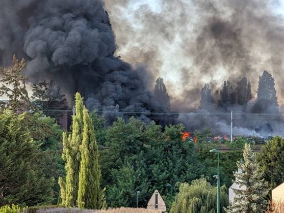 Major fire broke near Roissy-CDG Airport in Paris PARIS, FRANCE - AUGUST 11: A view of smoke after a fire broke in Louvres, near Roissy-CDG Airport, north of Paris, France on August 11, 2026. The fire led to the temporary closure of two of the airport’s runways. Rail and road traffic was partially disrupted. In total, nearly 110 firefighters were deployed and, according to initial reports, at least several dozen vehicles were destroyed by the flames. Luc Auffret Anadolu Paris France. Editorial use only. Please get in touch for any other usage.  Copyright: x2026xAnadoluxLucxAuffretx