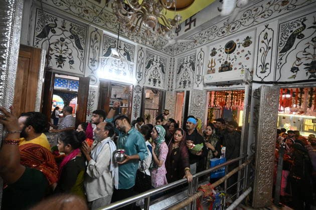 NEW DELHI, INDIA - AUGUST 11: Hindu devotees throng Shiva temple to offer prayers on Sawan Shivratri as devotees offering milk and water on Shiva linga at Gauri Shankar Mandir, Chandni Chowk on August 11, 2026 in New Delhi, India. Shravan Shivratri is a sacred Hindu festival dedicated to Lord Shiva, observed on the Krishna Paksha Chaturdashi tithi of the holy month of Shravan. The festival commemorates Lord Shiva consuming the Halahala poison to save the universe during the churning of the cosmic ocean. The devotees bath the shivlinga with Gangajal, raw milk, honey, curd, ghee (Panchamrit) and other cooling liquids to help soothe his intense heat. (Photo by Ishant Chauhan Hindustan Times) Devotees Throng Shiva Temples On Occasion Of Shravan