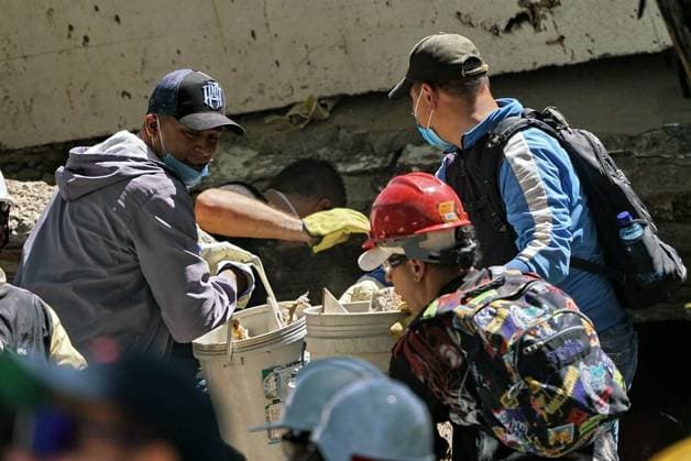 (260812) -- CALI, Aug. 12, 2026 -- Rescuers conduct search and rescue operation on the ruins of a building damaged in an earthquake in Cali, Colombia, Aug. 11, 2026. The death toll from Monday s 7.4-magnitude earthquake in western Colombia has risen to 188, with 1,677 others injured, the Colombian Association of Capital Cities, or Asocapitales, said Tuesday. Asocapitales said it has launched a system to report and search for missing persons as rescue and damage assessment work continues. ( Handout via Xinhua) (SpotNews) COLOMBIA-CALI-EARTHQUAKE-SEARCH AND RESCUE COLPRENSA 