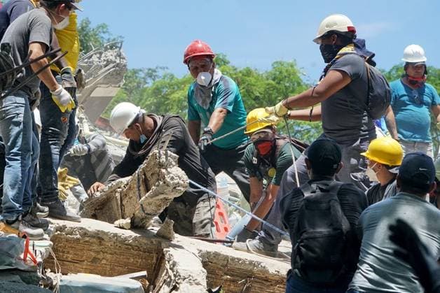 (260812) -- BEIJING, Aug. 12, 2026 -- Rescuers conduct search and rescue operation on the ruins of a building damaged in an earthquake in Cali, Colombia, Aug. 11, 2026. The death toll from Monday s 7.4-magnitude earthquake in western Colombia has risen to 188, with 1,677 others injured, the Colombian Association of Capital Cities, or Asocapitales, said Tuesday. Asocapitales said it has launched a system to report and search for missing persons as rescue and damage assessment work continues. ( Handout via Xinhua) XINHUA PHOTOS OF THE DAY COLPRENSA 