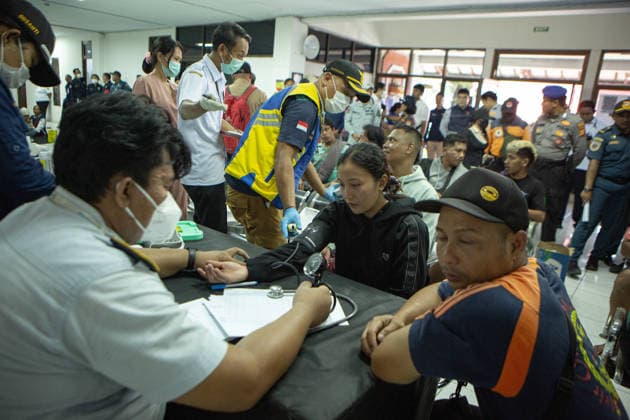 August 12, 2026, Karangasem, Bali, Indonesia: Passengers of the ferry KMP Putri Yasmin await data collection and medical examinations at the ASDP Emergency Post in Padangbai Port, Karangasem, Bali. ...A navy vessel and surrounding ships rushed to rescue 131 people onboard (114 passengers and 17 crew members) after the inter-island ferry caught fire in the Sekotong waters of the Lombok Strait at around 4:15 AM local time during its voyage to Lembar, Lombok. Authorities confirmed 35 survivors were evacuated back to Padangbai, while the remaining were transported to Lombok. One casualty was reported in the incident. Karangasem Indonesia - ZUMAp229 20260812_zip_p229_003 Copyright: xLanaxPriatnax