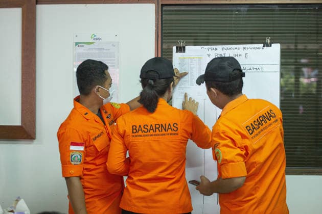 August 12, 2026, Karangasem, Bali, Indonesia: Passengers of the ferry KMP Putri Yasmin await data collection and medical examinations at the ASDP Emergency Post in Padangbai Port, Karangasem, Bali. ...A navy vessel and surrounding ships rushed to rescue 131 people onboard (114 passengers and 17 crew members) after the inter-island ferry caught fire in the Sekotong waters of the Lombok Strait at around 4:15 AM local time during its voyage to Lembar, Lombok. Authorities confirmed 35 survivors were evacuated back to Padangbai, while the remaining were transported to Lombok. One casualty was reported in the incident. Karangasem Indonesia - ZUMAp229 20260812_zip_p229_009 Copyright: xLanaxPriatnax