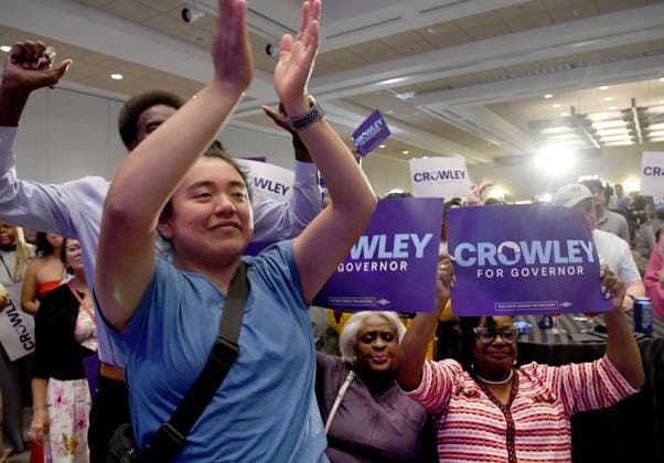 August 11, 2026, Milwaukee, Wisconsin, USA: Supporters of Democratic gubernatorial candidate David Crowley including ANA WILSON and CONG. GWEN MOORE in striped dress react to television news reports during a watch party Tuesday night August 11, 2026 at the Hyatt Regency hotel in downtown Milwaukee. Crowley had not appeared by Midnight. The race against Francesca Hong was still very close when it was announced that human error caused a delay in counting absentee ballots from Milwaukee. Milwaukee USA - ZUMAh154 20260811_znp_h154_040 Copyright: xMarkxHertzbergx